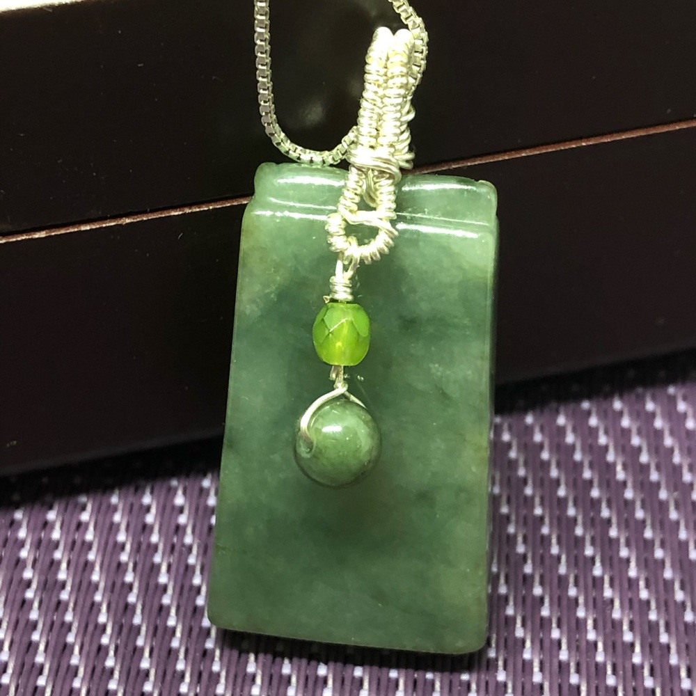 Green jade on silver wire warp pendant